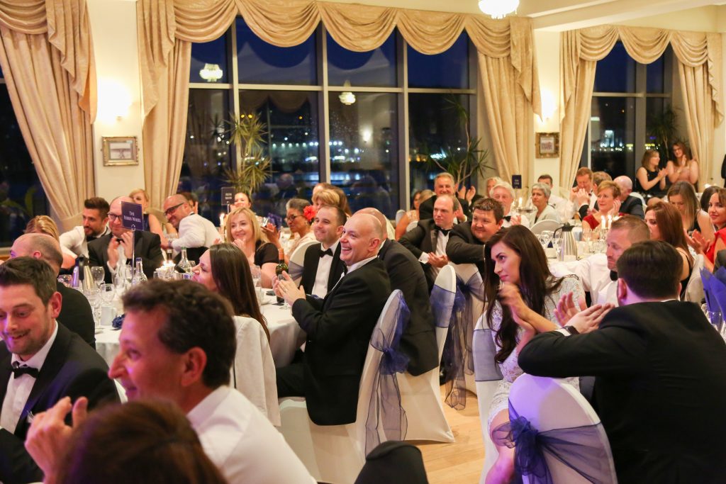 a selection of tables and guests at the Ascot Group Summer Ball event