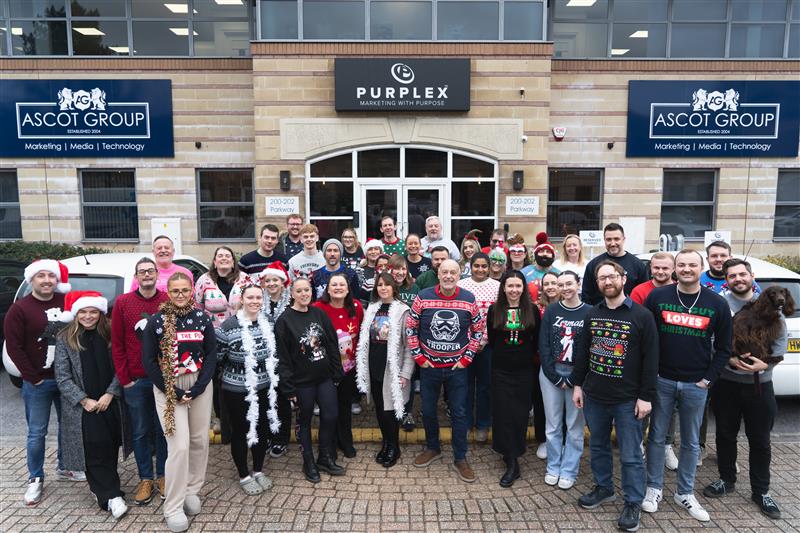 Children charity supporters at The Ascot Group in Christmas jumpers backing the Every Child Needs Christmas appeal