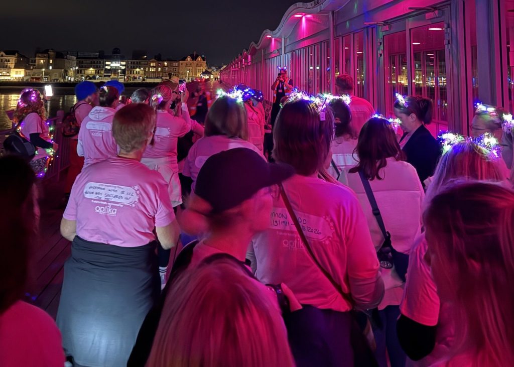 Weston Hospicecare Moonlight Beach Walk participants walking along Weston-super-Mare seafront at night
